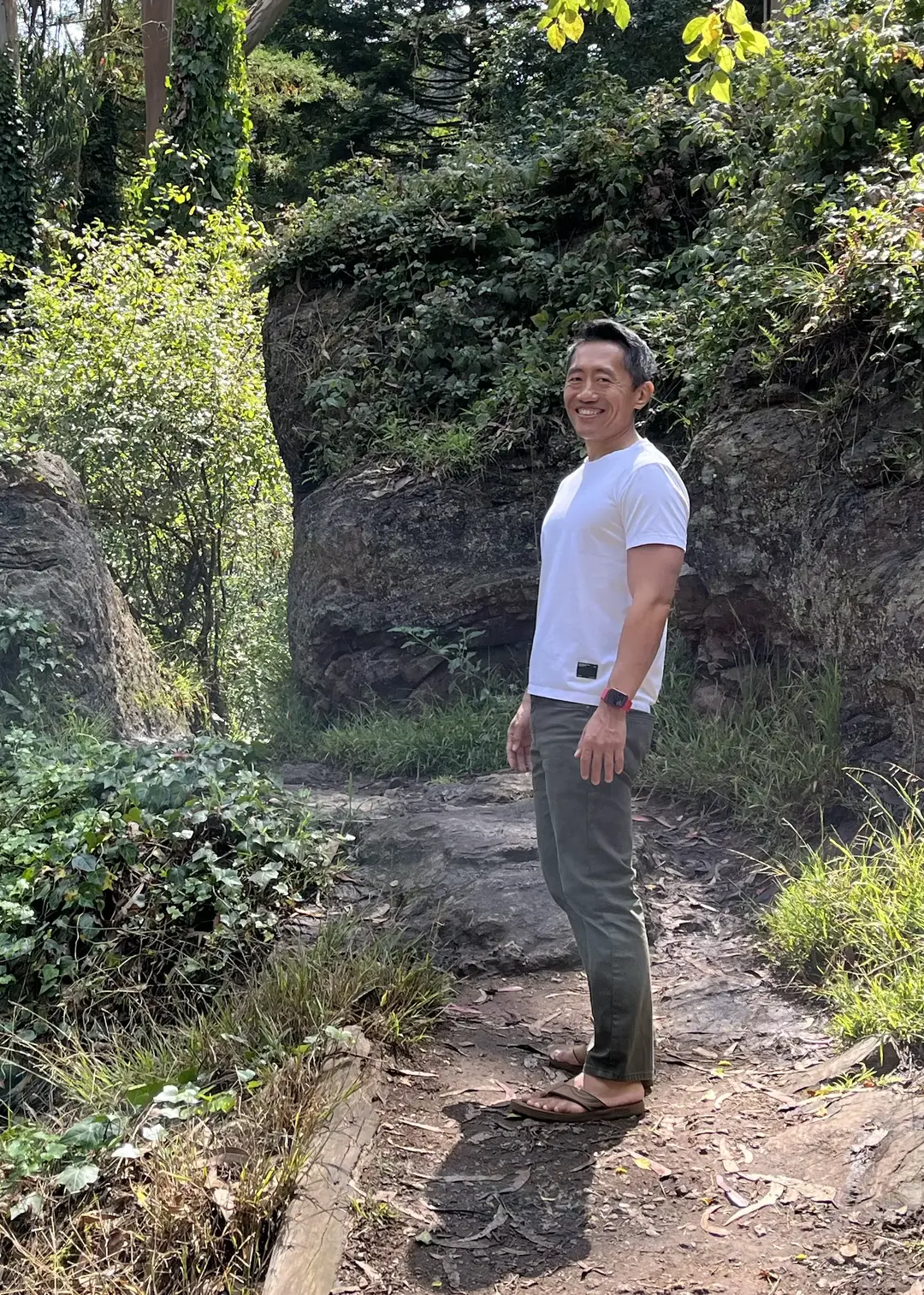 Shu Liu walking on a trail